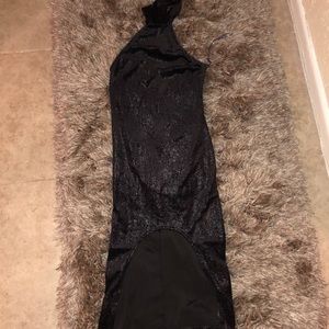 Sleeveless black snakeskin dress.